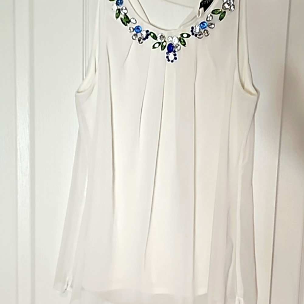 Whbm white top with jewels around the neck.
